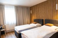 Postel nebo postele na pokoji v ubytování Hotel Sharingham