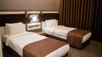 Postel nebo postele na pokoji v ubytování Sam Royal Hotel