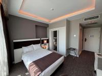 Postel nebo postele na pokoji v ubytování Sam Royal Hotel