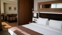 Postel nebo postele na pokoji v ubytování Sam Royal Hotel