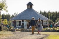 two women walking in front of a building at Raba Kärg, in Pihali