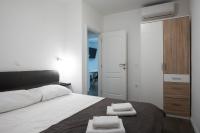 Posteľ alebo postele v izbe v ubytovaní Pyrotima Apartments