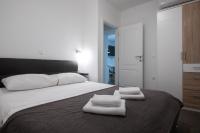 Posteľ alebo postele v izbe v ubytovaní Pyrotima Apartments