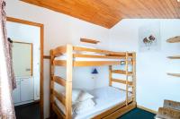 Łóżko lub łóżka w pokoju w obiekcie Résidence Le Squaw Valley - DUPLEX 3 Pièces 7/8 pers - LE SQUAW VALLEY - PLAGNE VILLAGES MAE-1734