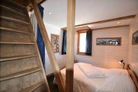 Łóżko lub łóżka w pokoju w obiekcie Résidence Le Squaw Valley - DUPLEX 3 Pièces 7/8 pers - LE SQUAW VALLEY - PLAGNE VILLAGES MAE-1734