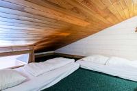 Łóżko lub łóżka w pokoju w obiekcie Résidence Le Squaw Valley - DUPLEX 3 Pièces 7/8 pers - LE SQUAW VALLEY - PLAGNE VILLAGES MAE-1734