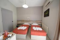 Posteľ alebo postele v izbe v ubytovaní Bikakis Family Apartments