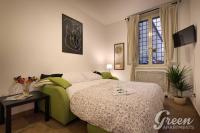A bed or beds in a room at Green Apartments Rome