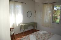A bed or beds in a room at Comfortable Apartment Near The Sea