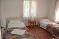 A bed or beds in a room at Comfortable Apartment Near The Sea