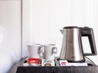 a counter with a coffee pot and cups on it at Delamar 4*Sup-Adults only (18+) in Lloret de Mar