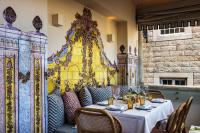 a restaurant with a table and chairs and a fireplace at Villa Cascais Boutique Hotel in Cascais