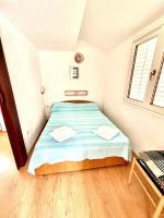 Posteľ alebo postele v izbe v ubytovaní Apartments by the sea Sukosan, Zadar - 5819