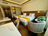 Postel nebo postele na pokoji v ubytování Fortune Plaza Hotel, Dubai Airport