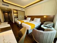 Postel nebo postele na pokoji v ubytování Fortune Plaza Hotel, Dubai Airport