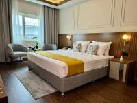 Postel nebo postele na pokoji v ubytování Fortune Plaza Hotel, Dubai Airport