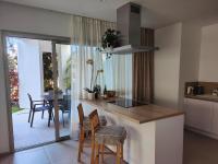 A kitchen or kitchenette at Garden Suites luxury apartment