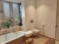 A bathroom at Garden Suites luxury apartment