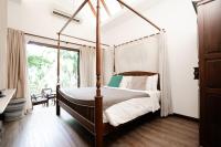 Postel nebo postele na pokoji v ubytování Tolani Southgate Villa Chiang Mai