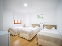 Posteľ alebo postele v izbe v ubytovaní Texeda Room Suites