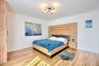Posteľ alebo postele v izbe v ubytovaní Westa Apartamenty