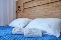 Posteľ alebo postele v izbe v ubytovaní Westa Apartamenty