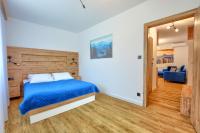 Posteľ alebo postele v izbe v ubytovaní Westa Apartamenty