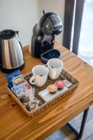 a tray with cups and cookies on a table at Lares De Chacras in Chacras de Coria