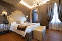 Posteľ alebo postele v izbe v ubytovaní Hotel Canaletto