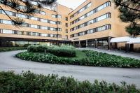 a building with a road in front of it at Scandic Kuopio in Kuopio