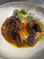 een bord met eten op een tafel bij The Highland Drove in Great Salkeld