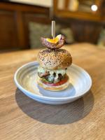 een stapel bagels op een bord op een tafel bij The Highland Drove in Great Salkeld