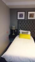 The Bulls Head Hotelにあるベッド