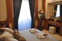 A bed or beds in a room at Rome Imperial Crown