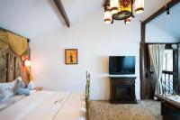 Big Tree Guesthouse - Naxi old styleにあるベッド