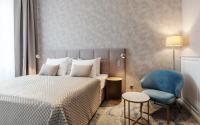 Postel nebo postele na pokoji v ubytování Grandhotel Brno