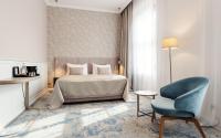 Postel nebo postele na pokoji v ubytování Grandhotel Brno