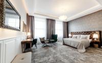 Postel nebo postele na pokoji v ubytování Grandhotel Brno