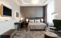 Postel nebo postele na pokoji v ubytování Grandhotel Brno