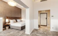 Postel nebo postele na pokoji v ubytování Grandhotel Brno
