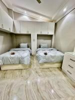 Postel nebo postele na pokoji v ubytování 2Bedrooms Penthouse's-New Cairo