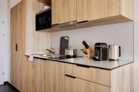 Kuchyň nebo kuchyňský kout v ubytování District Living
