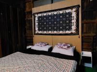 Postel nebo postele na pokoji v ubytování HostelBed and Retreat Phitsanulok