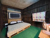 Postel nebo postele na pokoji v ubytování HostelBed and Retreat Phitsanulok