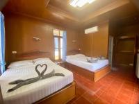 Postel nebo postele na pokoji v ubytování Rainbow Bungalow Haadrin Koh Phangan
