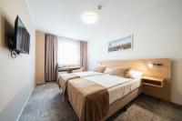 Łóżko lub łóżka w pokoju w obiekcie Hotel Ehrlich Prague