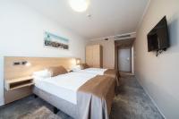 Łóżko lub łóżka w pokoju w obiekcie Hotel Ehrlich Prague
