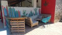 a building with a mural of cacti on the wall at Yourtes Olachat proche Annecy in Faverges