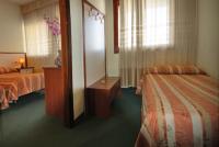 Łóżko lub łóżka w pokoju w obiekcie Hotel Kristall
