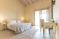 A bed or beds in a room at Agriturismo Colle Dei Pivi
